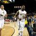 Michigan senior Eso Akunne and freshman Mitch McGary leave the court after beating Saginaw Valley State 76-48 on Monday. Daniel Brenner I AnnArbor.com